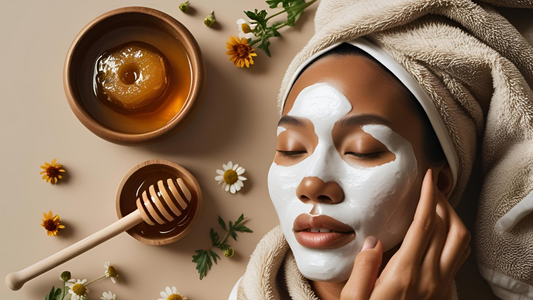 Jar of raw honey beside natural skincare tools, towel, and flower petals on a spa tray